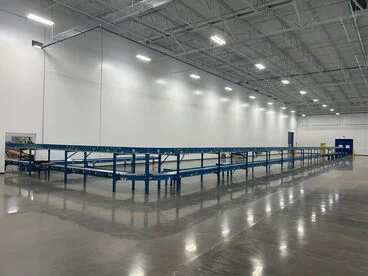 Industrial vertical reciprocating conveyor (VRC) freight lift for moving warehouse handling equipment between floor levels