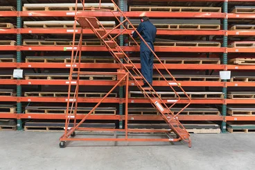 Well-organized warehouse facility featuring high-density storage racks and modern warehouse handling equipment