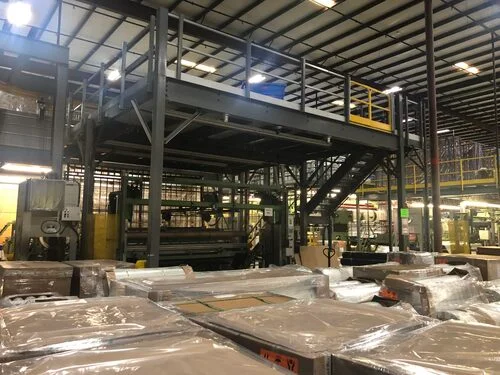 Rows of newly installed teardrop pallet racking systems for warehouse storage